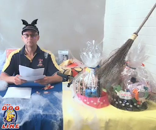 TDL TV host, Colin, on a Halloween set-up with Dog Gift Hampers ready for the live draw